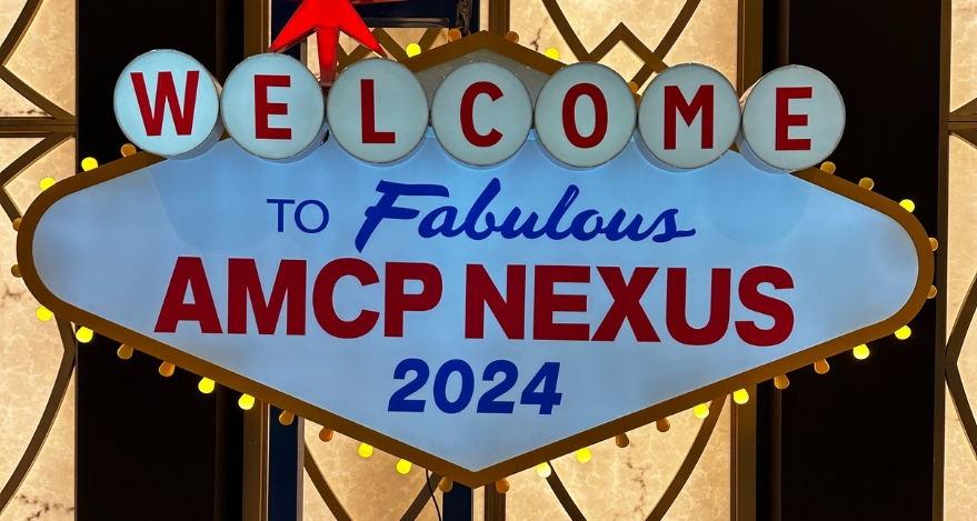 A sign reads: Welcome to Fabulous AMCP Nexus 2024