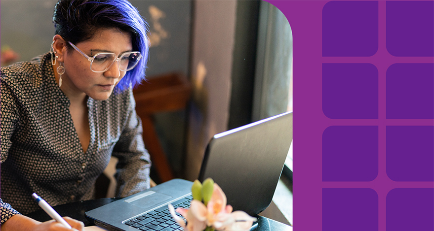 A woman works at her computer