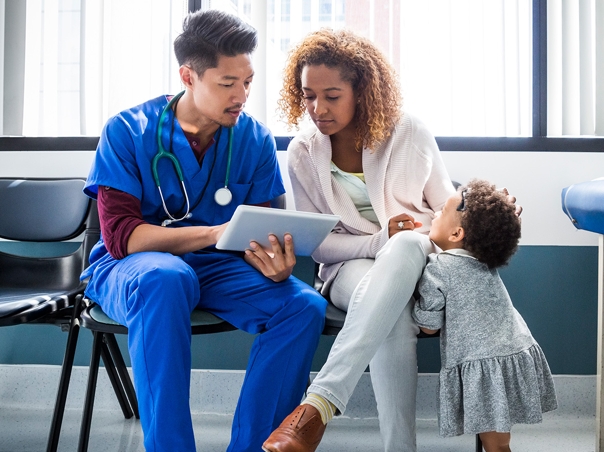 Photo of provider showing mom and child ipad